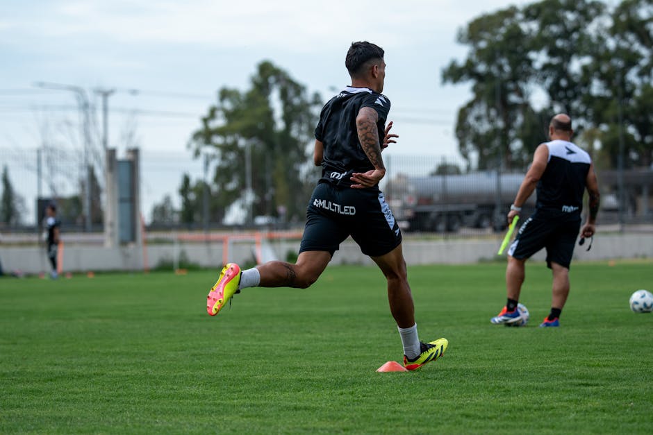 Certified trainer supervising professional speed and agility training development